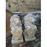 Pair of lions with welcome shields