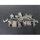 Vintage silver charm bracelet with 15 charms. Weight 49g