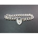 Heavy silver bracelet with padlock and safety chain - every link stamped and fully hallmarked