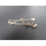 Vintage silver charm bracelet London 1977 6 charms 34 grams