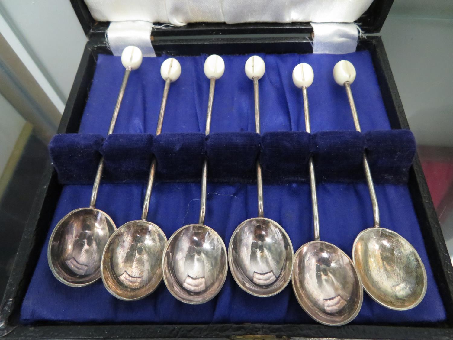 Box of coffee spoons and other plated ware