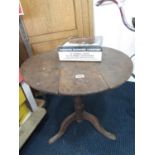 Early mahogany tilt top table requires some attention