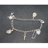 Silver charm bracelet with 5 dainty charms HM London 1988 11g