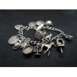 Vintage silver bracelet George Jensen 15 charms padlock and safety chain 58g