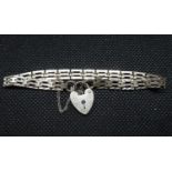 Vintage silver diamond cut gate bracelet with padlock and safety chain HM London 1978 weight 8.