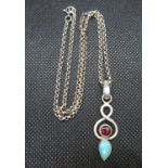 Silver Art Nouveau style pendant set with garnet and turquoise on 16" belcher chain 10 grams