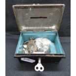 Small money box containing silver threepenny bits and a silver fob weight 132grams silver