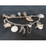 Vintage silver charm bracelet 11 charms 34grams