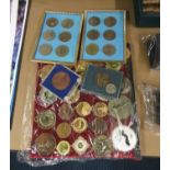 2 sets of coins framed and large collection of running medals from all over the world