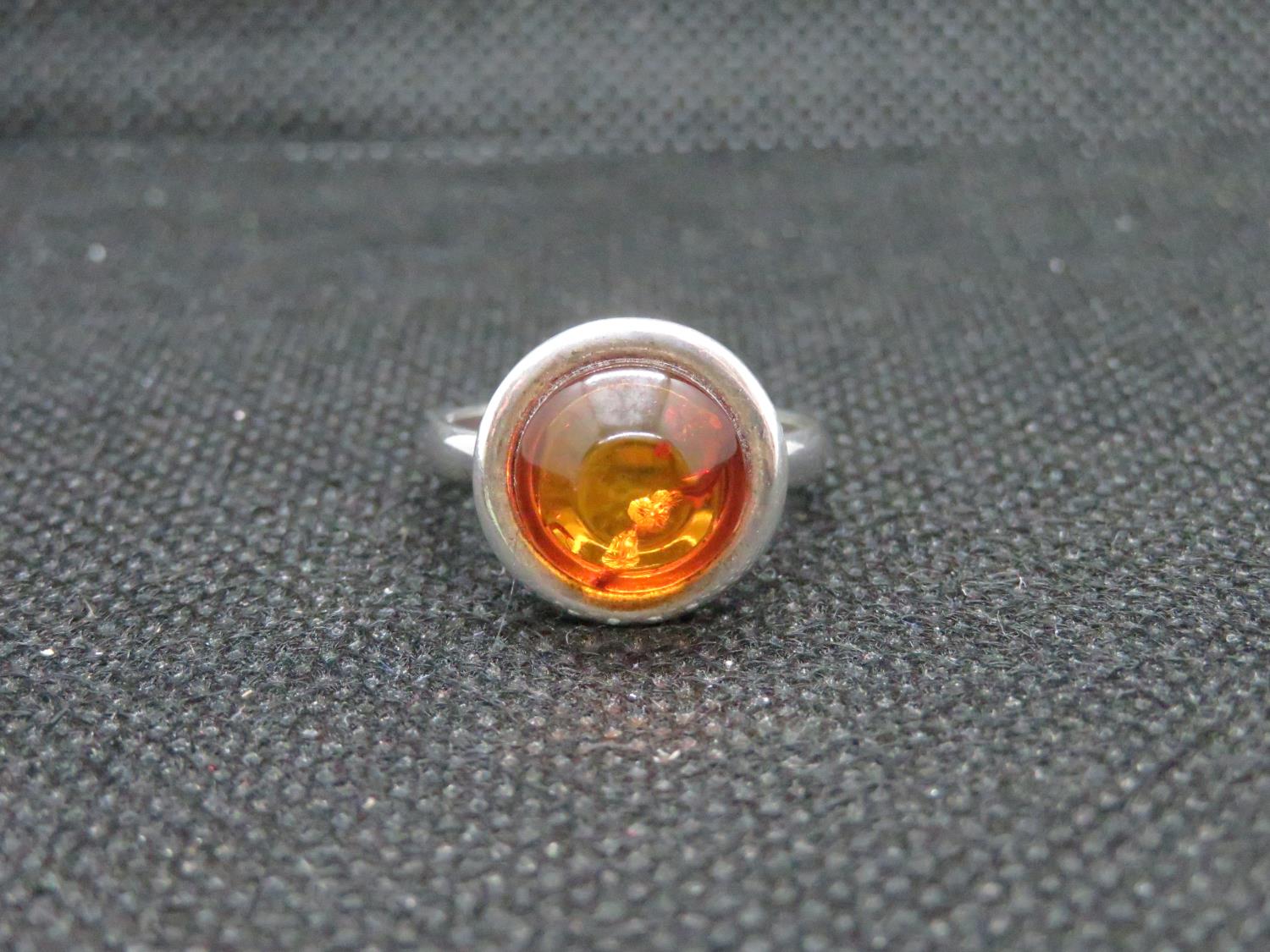 Silver round amber cabochon ring