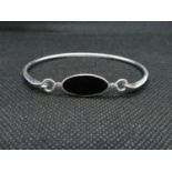 Silver bangle set with oval black onyx stone stamped 925 6.5grams