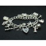 Vintage silver charm bracelet with 15x charms HM London 1955 69grams