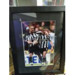 Framed glazed and signed Newcastle players photo