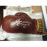 Everlast boxing glove signed in silver by ex-champion Larry Holmes