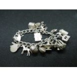 Vintage silver charm bracelet with 14 excellent charms HM Birmingham 1955 58grams