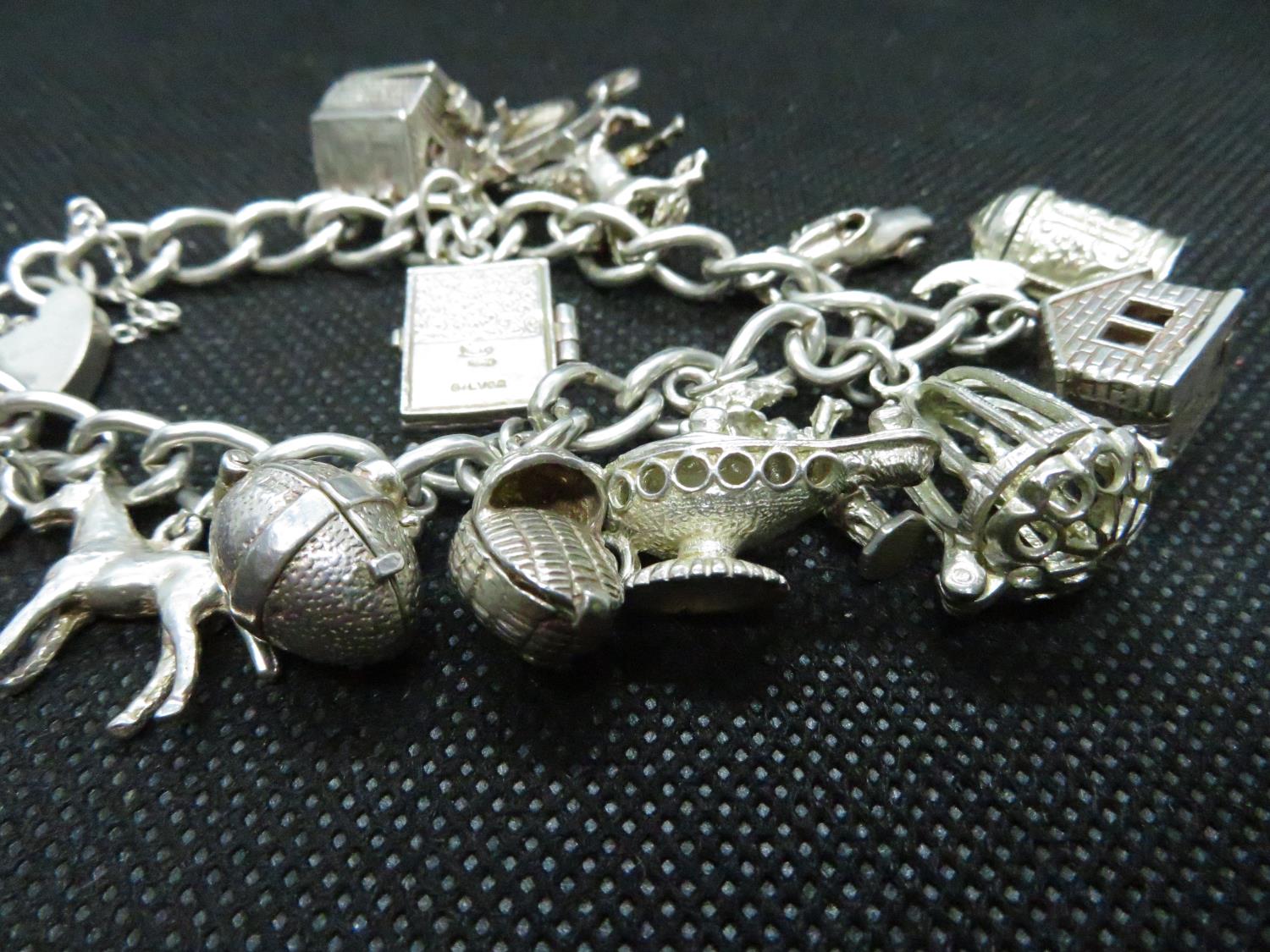 Vintage silver charm bracelet with 14 excellent charms HM Birmingham 1955 58grams - Image 2 of 2