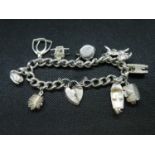 Vintage silver charm bracelet with 9x nice charms HM London 1978 65 grams