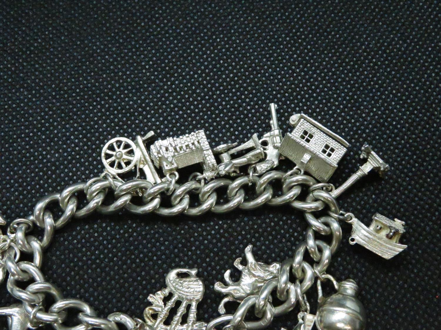 Vintage silver charm bracelet with 15x charms HM London 1955 69grams - Image 2 of 3