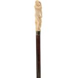 A LATE 19TH/EARLY 20TH CENTURY WALKING CANE, the ivory handle carved as a naked Classical figure