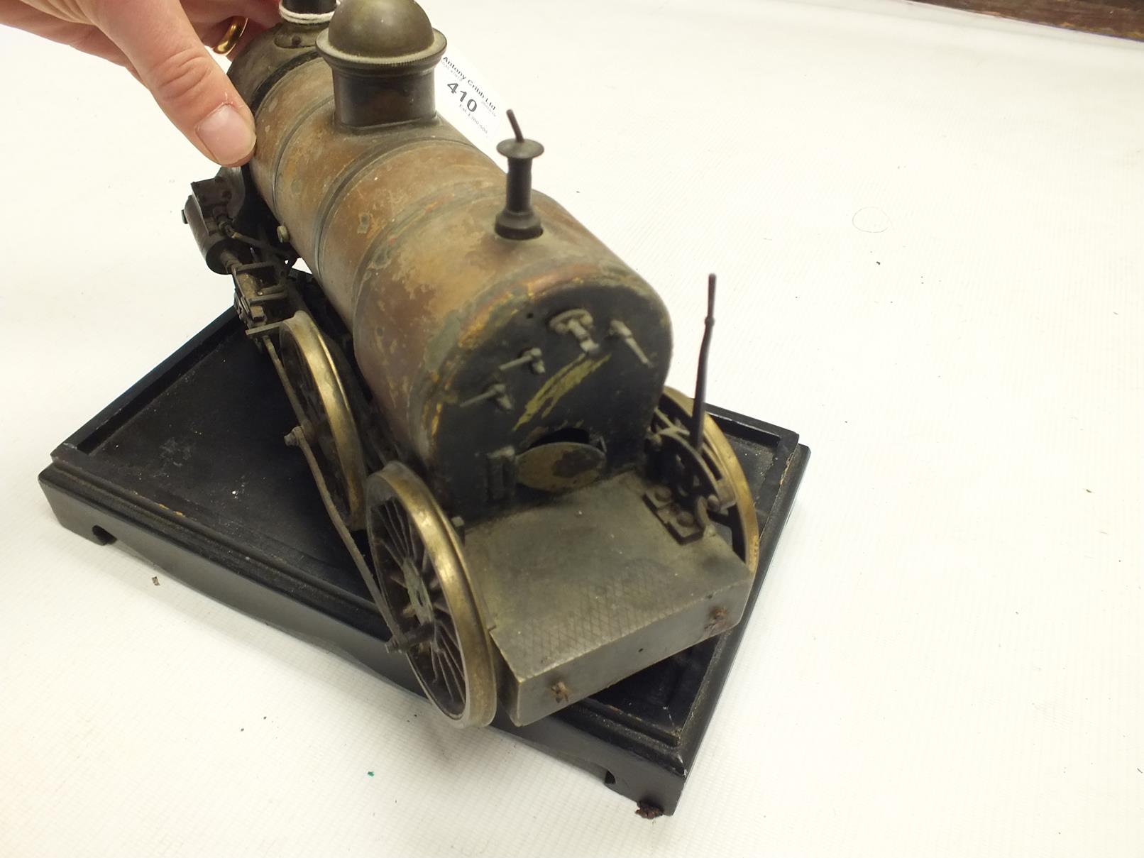 A LIVE STEAM LOCOMOTIVE, lacquered body, 27cm long, on associated ebonised plinth. - Image 10 of 10