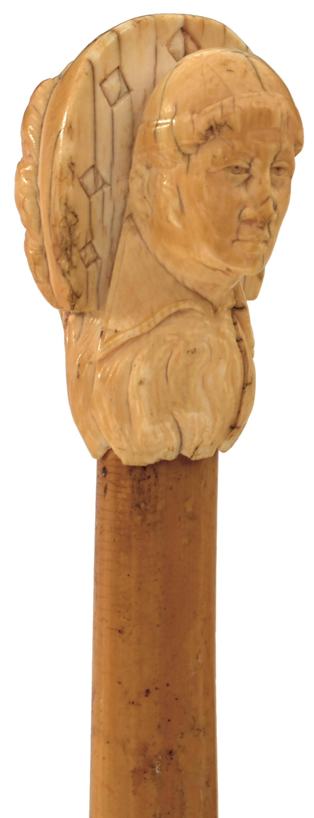 A 19TH CENTURY WALKING CANE, the early ivory handle carved as the head of a Cardinal, bamboo haft,