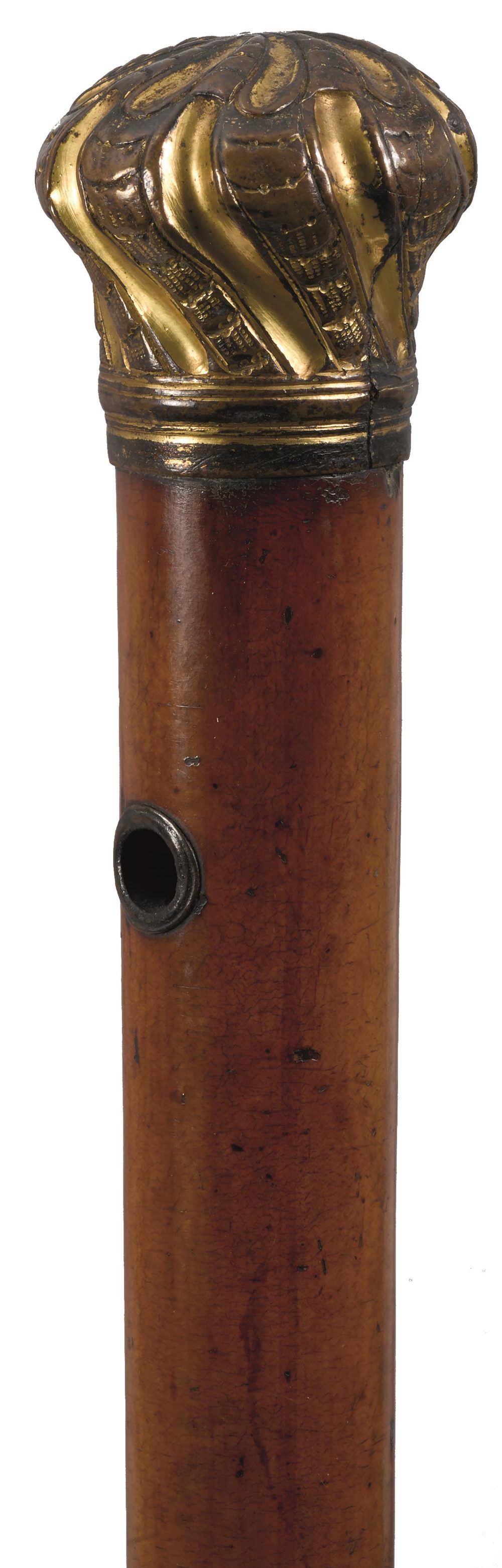 A LATE 19TH CENTURY WALKING CANE, the handle of plated spiralled cushion form, malacca haft