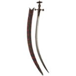 A 19TH CENTURY TULWAR, 79cm sharply curved blade, characteristic hilt with trefoil langets and