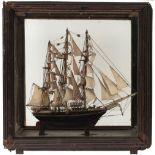 229-56 AN EARLY 20TH CENTURY MODEL OF A THREE MASTED SAILING SHIP, with rigging and sails hoisted,