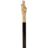 AN UNUSUAL 19TH CENTURY WALKING CANE, the ivory handle carved as a young lady seated in a chair,