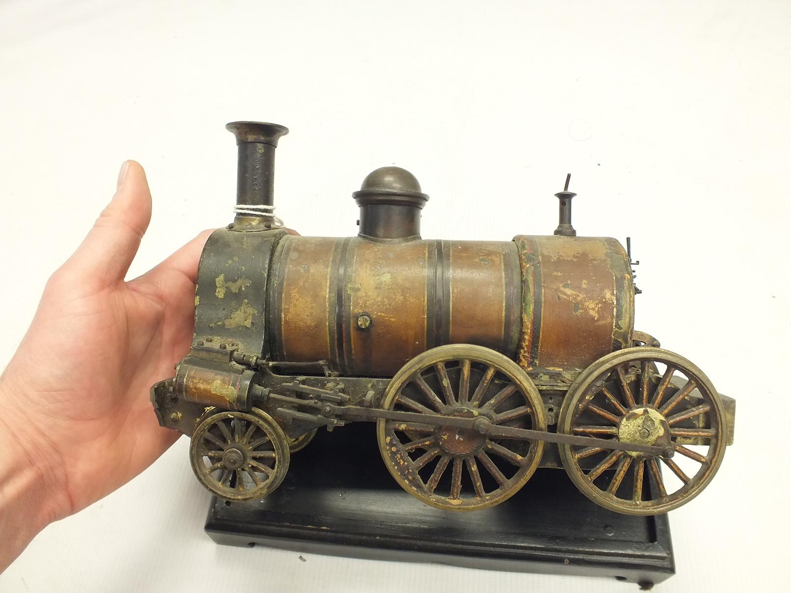 A LIVE STEAM LOCOMOTIVE, lacquered body, 27cm long, on associated ebonised plinth. - Image 8 of 10