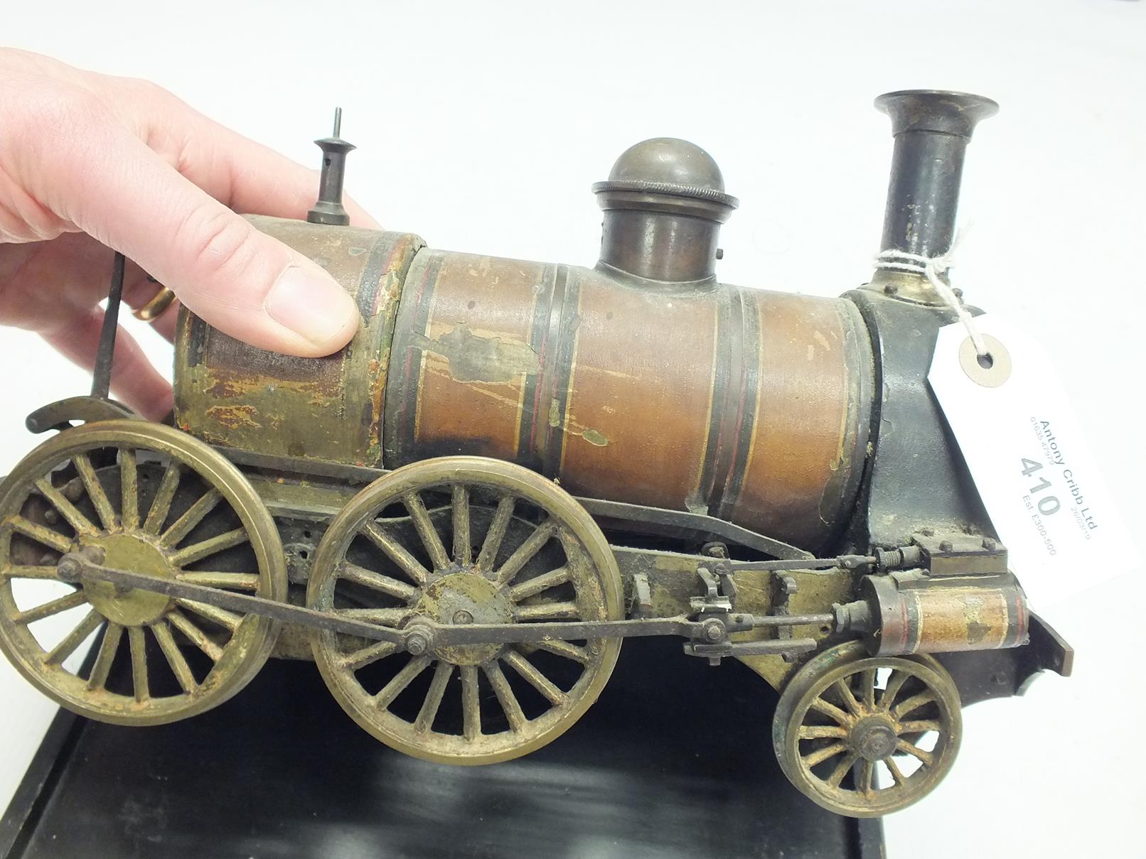 A LIVE STEAM LOCOMOTIVE, lacquered body, 27cm long, on associated ebonised plinth. - Image 4 of 10