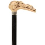 AN EARLY 20TH CENTURY WALKING CANE, the ivory handle carved as three horse's heads, above white