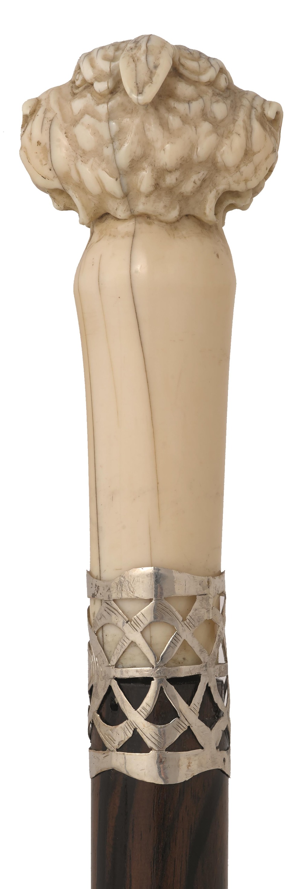 A LATE 19TH CENTURY WALKING CANE, the ivory pommel carved as a double headed dog, white metal