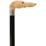 A LATE 19TH CENTURY WALKING CANE, the ivory handle carved as the head of a greyhound with glass