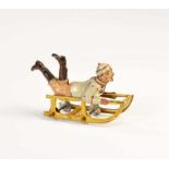 Penny Toy, Boy on Sledge, Germany pw, tin, min. paint d., C 1-2Penny Toy, Junge auf Schlitten,