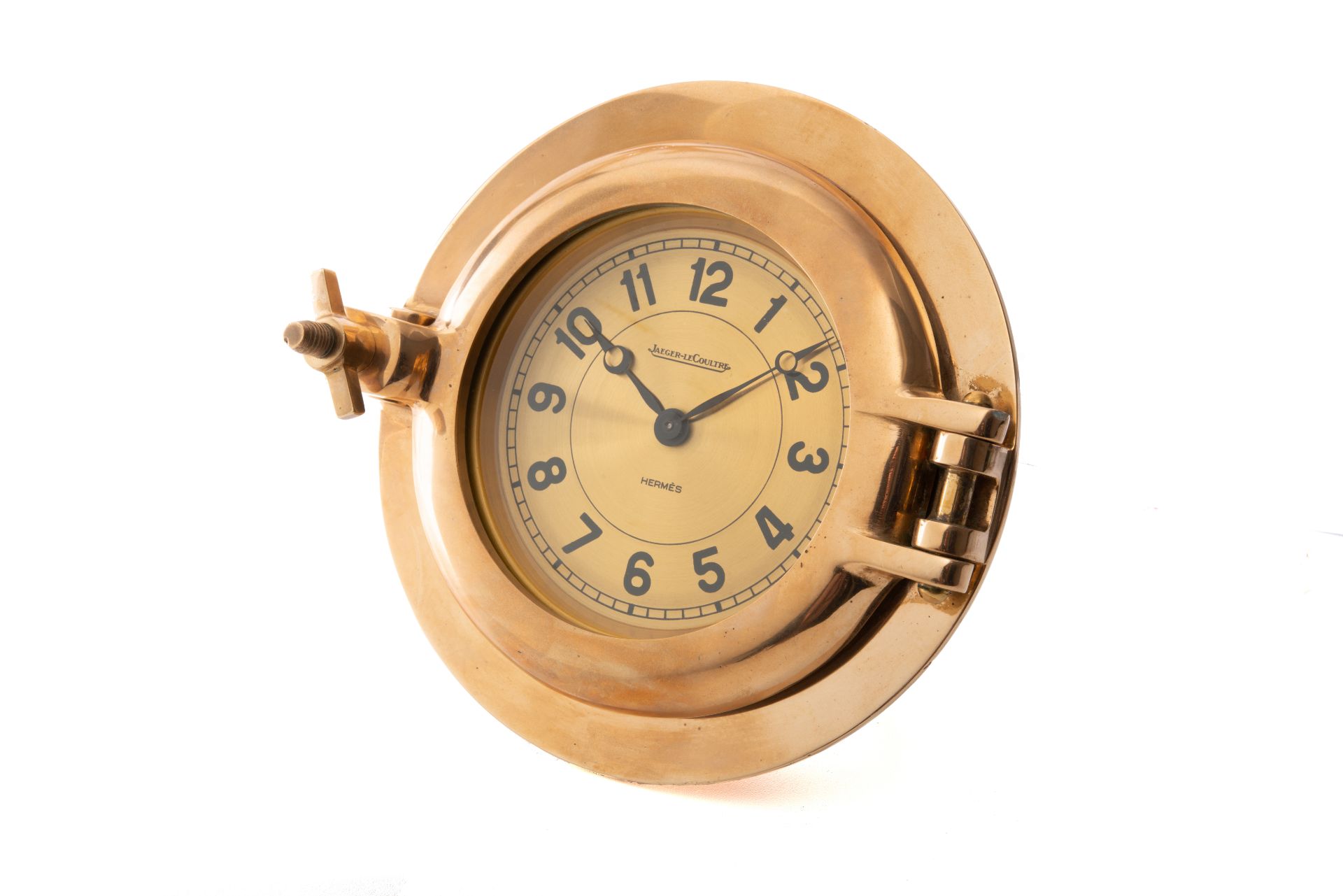 JAEGER-LECOULTRE AND HERMÈS, HUBLOT DESK CLOCK, GILT BRASS. Fine gilt brass porthole [...]