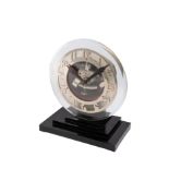 ATO, GLASS AND CHROME. Unusual glass and chrome table clock, black stepped base. [...]