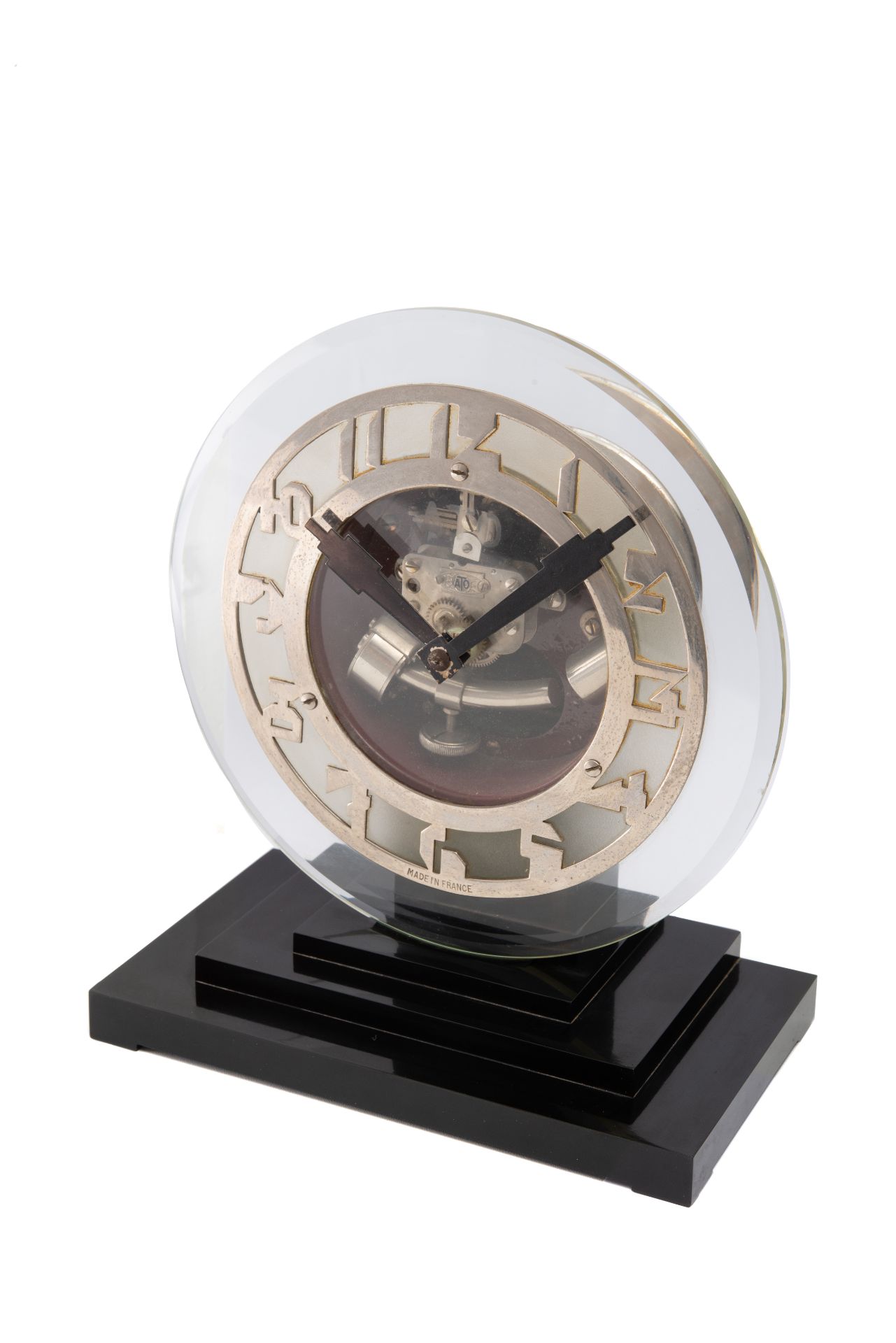 ATO, GLASS AND CHROME. Unusual glass and chrome table clock, black stepped base. [...]