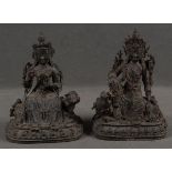 Zwei sitzende Bodhisattva auf Fabeltier. Metall, mit Resten alter Vergoldung, je H=38 cm. (rest.)