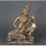 Sitzende, weibliche Gottheit mit Saiteninstrument. Thailand 19. Jh. Bronze, vergoldet, H=37,5 cm.