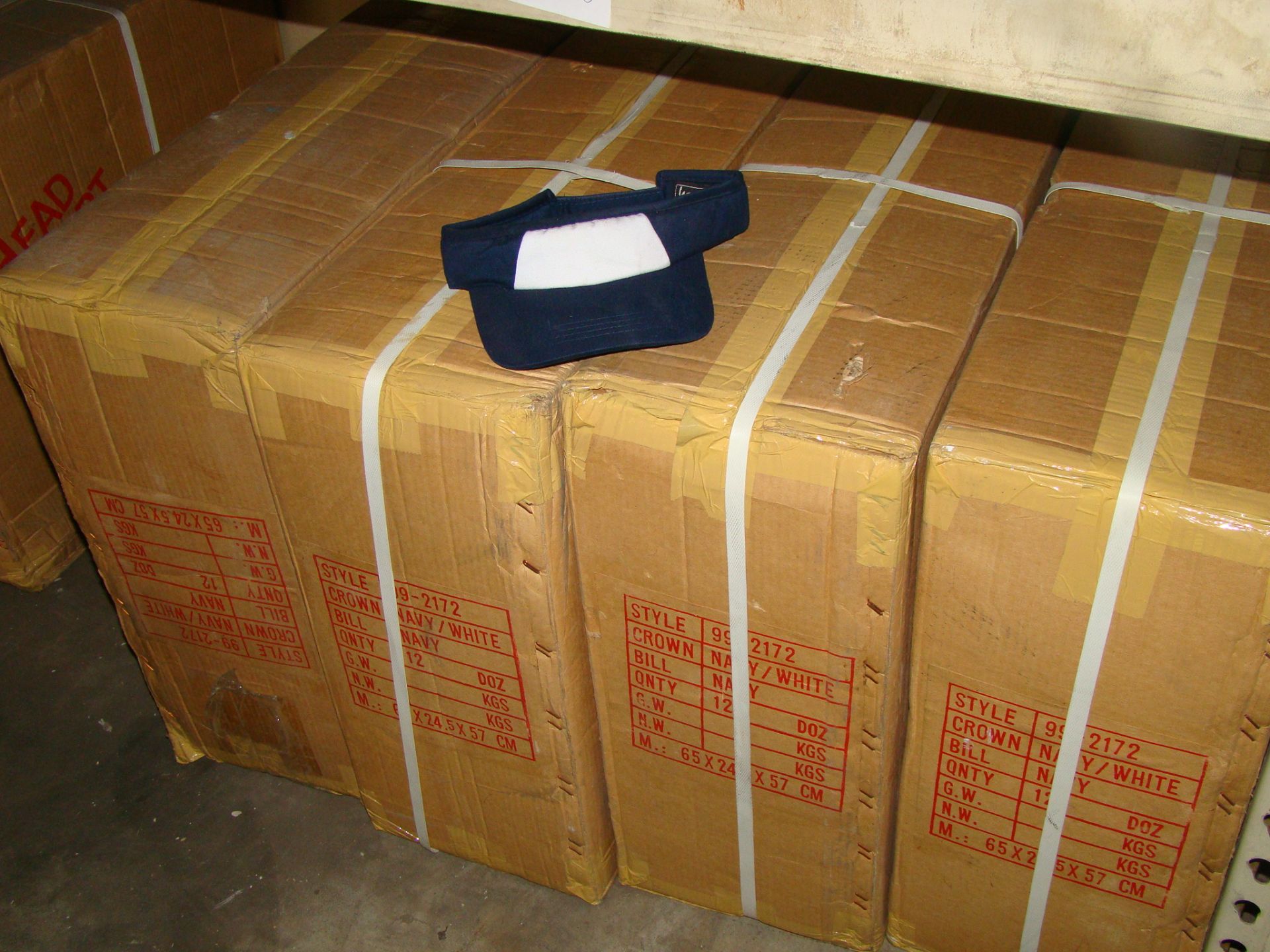 4 Boxes of Navy/White visors (144 per box)