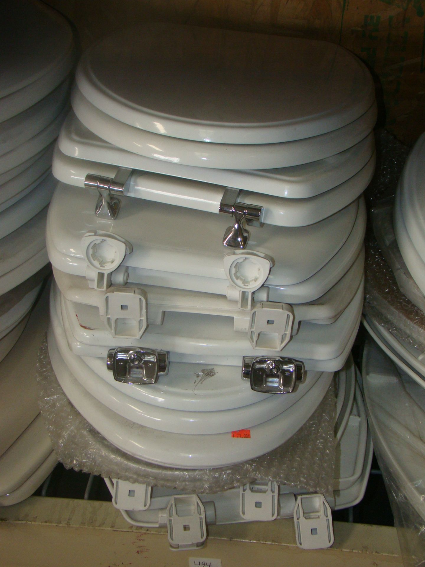 Stack of toilet lids