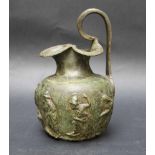 Bronze Jug, in ancient style with handgrip and decorations, verdigris rounded spouts.Height 20 cm