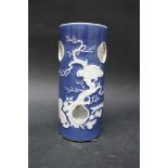 Mandarine porcelain cap stand, cylindrical shape with six open windows and white reliefs,