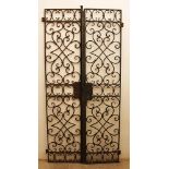 Forged iron door with two sections, rectangular shape, with rich open door decorations in Baroque