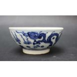 Asian porcelain cup, With blue ornaments of dragons and flowers, on white ground, glazed in the