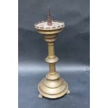 German candle holder on three feet, base with central column and stepped top bronze, on iron