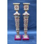 Pair of wooden columns, canted shape with wooden carved fruit ornaments gilded and naturalistic