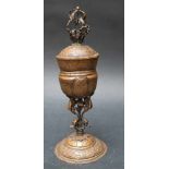 Copper goblet, on central feet with buckled stand and three birds in the centre, the round cup