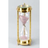 HourglassHourglass, mouth blown glass with pink sand in polished brass stand with compass on